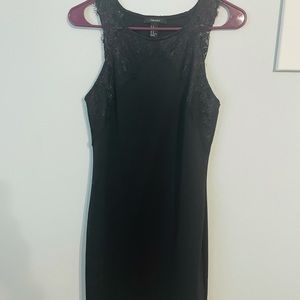 Black sleeveless fitted dress with lace detail